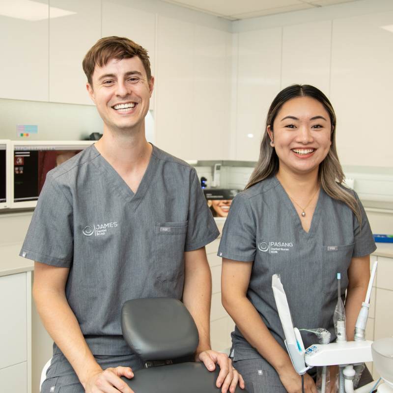 A dentist and a dental nurse in a treatment room